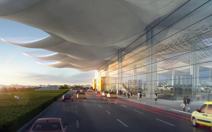 高雄國際機場全新航廈工程,將高雄海洋文化意象融入建築設計,形塑屬於港都特色的國際機場風貌。整體設計以翱翔天際的「海鷗」與連綿起伏的「白浪」為概念,堆疊出建築量體造型。此外,大跨距屋頂結構則以高雄美濃「油紙傘」為靈感,單元系統構件具備良好的擴充與銜接彈性。即使整體量體龐大,視覺上仍展現輕盈流動感。